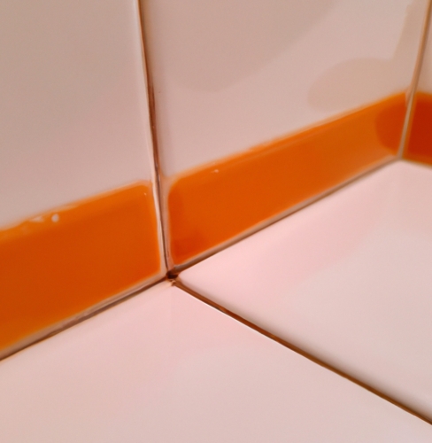 orange grout color between white tiles to avoid